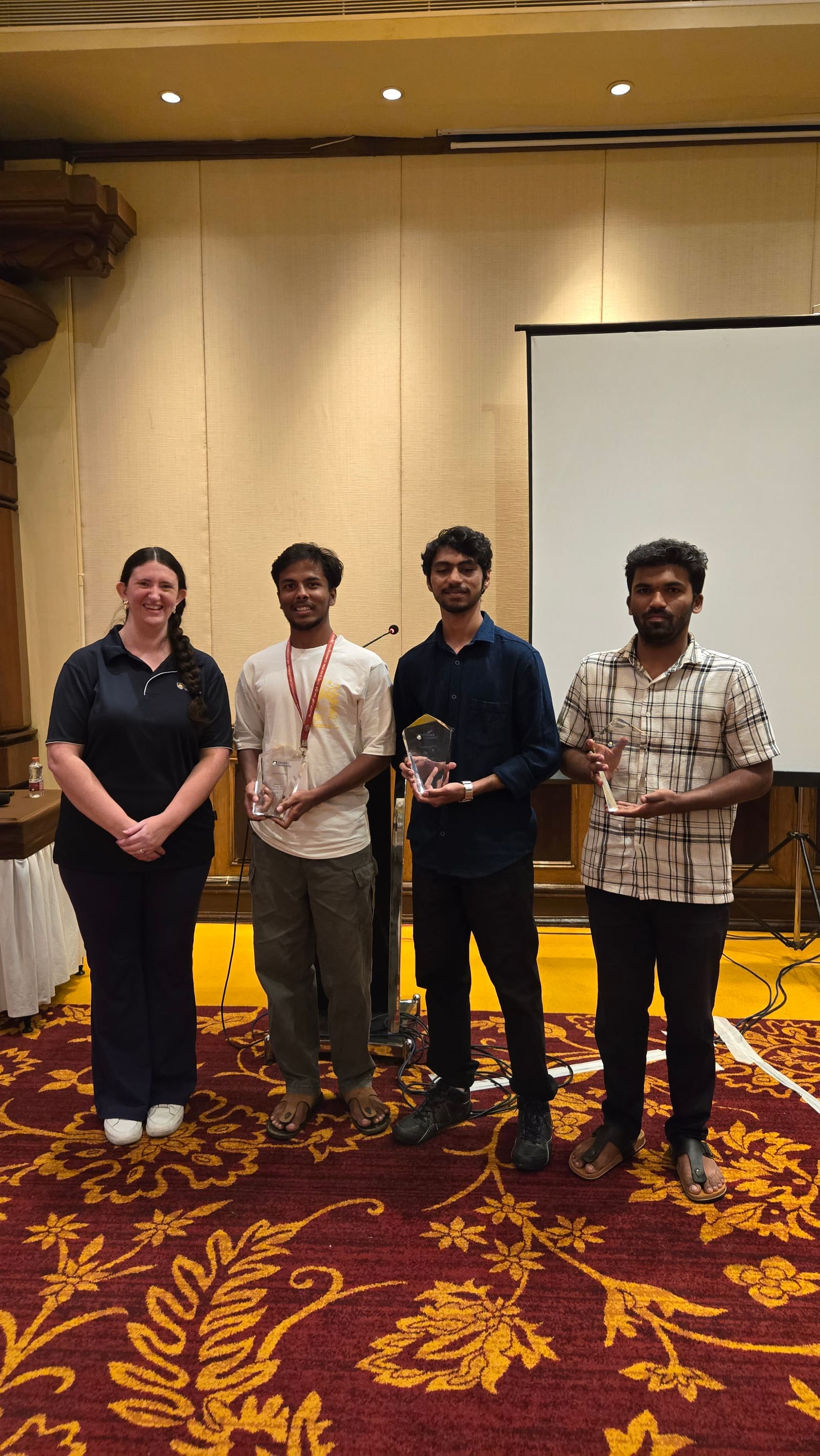 The winning team holding their 1st place trophies at the Flinders University AI Hackathon, Bengaluru round